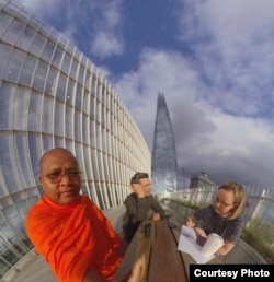Luon Sovath is interviewed by Times of London journalist Alice Foster at the newspaper's headquarters in London as filmmaker Chris Kelly looks on. (Luon Sovath)