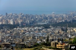 A general view, foreground, of the Ein el-Hilweh Palestinian refugee camp near the southern port city of Sidon, Lebanon, May 5, 2017.
