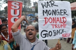 Activists of Socialist Unity Centre of India (Communist) shout slogans as they protest against US President Donald Trump's visit to India, in Siliguri February 24, 2020.
