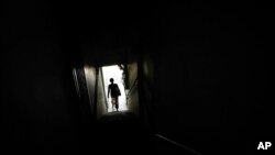 Tin, a Christian Burmese refugee, leaves a school after dropping off her children in Kuala Lumpur, Malaysia, March 11, 2017. Tin is a Christian Burmese who fled Myanmar and is hoping to resettle in the United States.