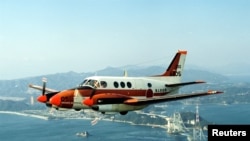 A Japan Maritime Self-Defense Forces' TC-90 training aircraft is seen in this undated handout photo released by the Japan Maritime Self-Defense Forces, and obtained by Reuters on August 5, 2015.