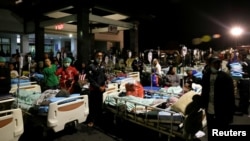 Patients are seen outside a hospital following a strong earthquake on nearby Lombok island, at a government hospital near Denpasar, Bali, Indonesia August 5, 2018.