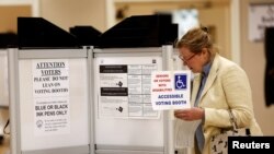 A woman casts her ballot in the District of Columbia in the final 2016 U.S. Democratic primary of the year, June 14, 2016. 