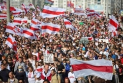 FILE - Opposition supporters take part in a rally against police brutality following protests to reject the presidential election results in Minsk, Belarus, Sept. 13, 2020. (Tut.By via Reuters)