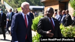 FILE - U.S. President Joe Biden with South Africa's President Cyril Ramaphosa at G7 meeting in Carbis Bay, Cornwall, Britain, June 12, 2021. (Leon Neal/Pool via REUTERS)