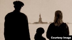 An immigrant family views the Statue of Liberty from Ellis Island in New York. 