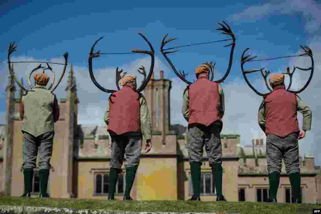 Dancers perform the 'Abbots Bromley Horn Dance' in the grounds of Blithfield Hall, near the village of Abbots Bromley, central England.