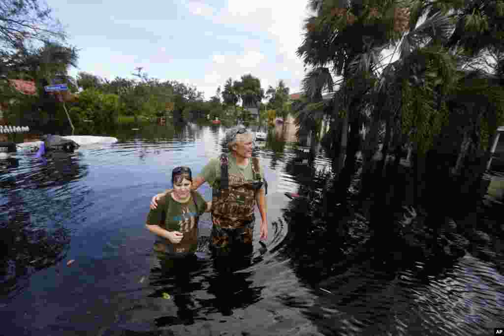 Kelly McClenthen returns to see the flood damage to her home with her boyfriend Daniel Harrison in the aftermath of Hurricane Irma in Bonita Springs, Florida, Sept. 11, 2017.