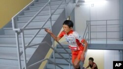 FILE - In this photo provided by ISF/Meeting, runner Yuri Yoshizumi competes during a race of Stairclimbing World Championships in Osaka, western Japan, on Nov. 19, 2023. (ISF/MEETING via AP)