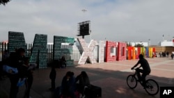 The words "Tijuana, Mexico" stand on the Mexican side of the border with the U.S. where migrants wait to be attended to apply for asylum in the U.S., in Tijuana, Mexico, June 9, 2019. 