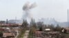 Smoke rises above a plant of Azovstal Iron and Steel Works company in Mariupol