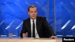Russian Prime Minister Dmitry Medvedev gives an interview to federal TV channels at the Ostankino TV Center In Moscow, Dec. 6, 2013. 