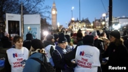 Nurses take part in a strike outside St Thomas' Hospital in London, Britain Dec. 15, 2022.