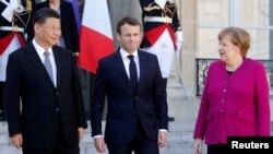 Rais wa Ufaransa Emmanuel Macron, Kansela wa Ujerumani Angela Merkel na Rais wa China Xi Jinping