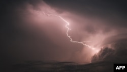 If something is a "flash in the pan," it not only comes quickly, but leaves quickly too. Pictured here, lightning flashes across the sky over Hanover, Germany, June 1, 2018. (AFP/DPA / Ole Spata)