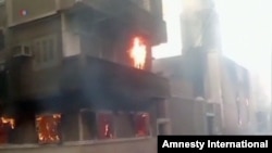 FILE - A Coptic church burning in Egypt.