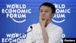 FILE - Chairman and chief executive of Alibaba Group Jack Ma reacts during a session of "Future-Proofing the Internet Economy" at the World Economic Forum (WEF) in China's port city Dalian, September 9, 2015.