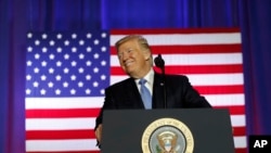President Donald Trump pauses while speaking about tax reform at the Farm Bureau Building at the Indiana State Fairgrounds, Sept. 27, 2017, in Indianapolis.