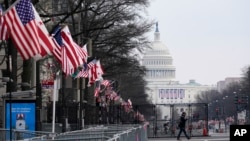 A view down Pennsylvania Avenue shows the security around the Capitol Hill in Washington, Friday, Jan. 15, 2021, ahead of the inauguration of President-elect Joe Biden and Vice President-elect Kamala Harris. (AP Photo/Susan Walsh)