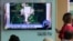 FILE - A TV screen shows a satellite image of a North Korean missile launch site, during a news program at the Seoul Railway Station in Seoul, South Korea, July 24, 2018. 