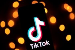 FILE - The logo of the social media video sharing app Tiktok is displayed on a tablet screen in Paris, November 21, 2019
