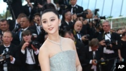 FILE - Actress Fan Bingbing poses for photographers upon arrival at the opening ceremony of the 71st international film festival, Cannes, southern France, Tuesday, May 8, 2018. (Photo by Joel C Ryan/Invision/AP)