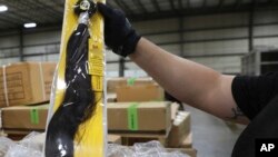 U.S. Customs and Border Protection detained a shipment of weaves believed to be made in a Chinese detention camp. The shipment is suspected to be human hair. Some information on the package was blurred by the source. 