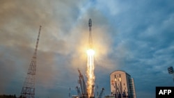 In this handout picture taken and released by the Russian Space Agency Roscosmos on August 11, 2023, a Soyuz 2.1b rocket with the Luna-25 lander blasts off from the launch pad at the Vostochny cosmodrome, some 180 km north of Blagoveschensk, in the Amur r