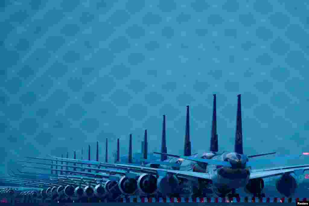 Thai Airways idle airplanes are seen parked on the tarmac of Suvarnabhumi Airport in Bangkok, Thailand.