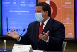 Florida Gov. Ron DeSantis speaks during a round-table discussion with Miami-Dade County mayors during the coronavirus pandemic, July 14, 2020, in Miami.