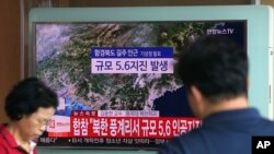 A man watches a TV reporting on a possible nuclear test conducted by North Korea at the Seoul Railway station in Seoul, South Korea, Sept. 3, 2017.