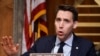 FILE - Sen. Josh Hawley, R-Mo., asks questions during a hearing in Washington, Dec. 16, 2020.