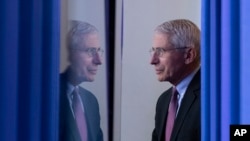 FILE - Dr. Anthony Fauci, director of the National Institute of Allergy and Infectious Diseases, arrives to speak about the coronavirus in the James Brady Press Briefing Room of the White House, in Washington, April 22, 2020.