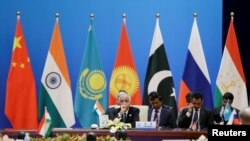 د هند هیئت د شانگهای د سا زمان په یوه غونډه کې د چین په بیجنگ کې اشتراک کوي؛ د مې ٢٢- مه ٢٠١٨ کال.