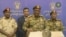  General Jamal Omar, center, a member of Sudan's Transitional Military Council, delivers a speech in Khartoum, July 11, 2019, in this screengrab from a broadcast on Sudan TV.