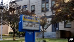 FILE - A sign is seen in front of the Yardville Elementary School in Hamilton Township, N.J., where a 4-year-old student died Thursday.