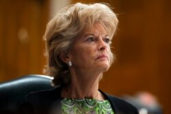 FILE - Sen. Lisa Murkowski, R-Alaska, listens during a hearing on Capitol Hill, June 23, 2020.