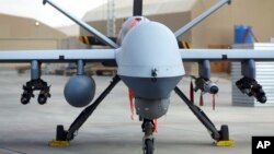 Arhiva - Američka bespilotna letjelica MQ-9 na izložbi tokom aeromitinga na pisti u Kandaharu, Afganistan, 23. januara 2018.