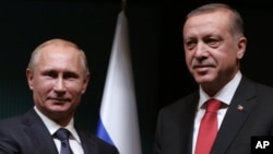FILE - Russian President Vladimir Putin, left, and his Turkish counterpart, Recep Tayyip Erdogan, wrap up a joint news conference at the Presidential Palace in Ankara, Turkey, Dec. 1, 2014, when they enjoyed more cordial relations. 