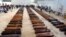 Coffin of victims are seen in an hangar of Lampedusa airport on October 5, 2013 after a boat with migrants sank killing more than hundred people. Italy mourned today the 300 African asylum-seekers feared dead in the worst ever Mediterranean refugee disast