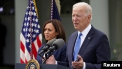 U.S. President Joe Biden, accompanied by Vice President Kamala Harris, speaks about the coronavirus disease (COVID-19) response and the vaccination program from the Rose Garden of the White House in Washington, U.S., May 13, 2021. REUTERS/Kevin Lamarque