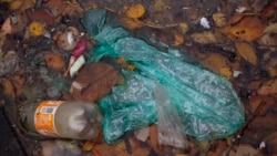 In this Wednesday, Nov. 6, 2019, image, plastic and other garbage floats in a collector of a new device that uses a curtain of tiny air bubbles to catch plastic floating in the capital's canals is seen in Amsterdam, Netherlands.