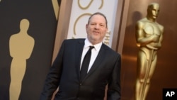 FILE - Harvey Weinstein arrives at the Oscars, March 2, 2014, at the Dolby Theatre in Los Angeles.