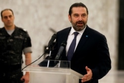 FILE - Saad Hariri, who quit as Lebanon's prime minister on Oct. 29, speaks after meeting President Michel Aoun at the presidential palace in Baabda, Lebanon, Nov. 7, 2019.
