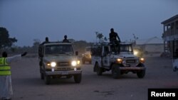 FILE - Vehicles transporting women and children rescued from Boko Haram by the Nigerian military arrive at the Internally displaced people's camp in Adamawa state, Nigeria, May 2, 2015.