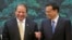 Pakistan's Prime Minister Nawaz Sharif (L) shares a light moment with Chinese Premier Li Keqiang before a signing ceremony held at the Great Hall of the People in Beijing July 5, 2013. REUTERS/Ng Han Guan/Pool (CHINA - Tags: POLITICS) - RTX11D76