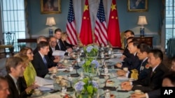 Deputy Sec. of State Antony J. Blinken, left, with China's State Councilor Yang Jiechi, right, and members of the US and Chinese delegations during a meeting at the 7th US China Strategic and Economic Dialogue (S&ED) and 6th Consultation on People-to-Peo