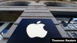 FILE PHOTO: The logo of Apple company is seen outside an Apple store in Bordeaux