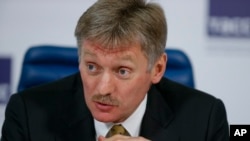 FILE - Russian President Vladimir Putin's press secretary Dmitry Peskova speaks at a round table to mark President Vladimir Putin’s 15 years in office, in Moscow, March 31, 2015.