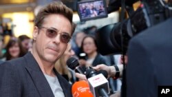 Robert Downey Jr. is interviewed upon arrival at the premiere for the film 'The Avengers Age of Ultron' in London, April, 21, 2015.